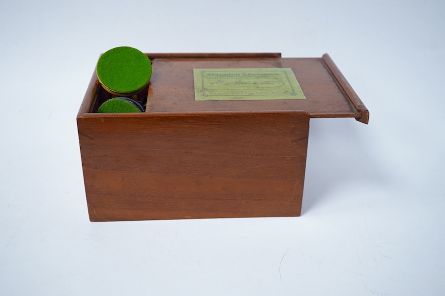 An early 20th century boxed J. Jaques & Son Staunton chess set, ebony and boxwood pieces, contained within the original velvet lined teak box with sliding lid and paper label to lid with facsimile of Howard Staunton sign